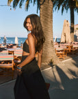 Woven maxi skirt. Ruched details. Side hook and eye and zipper closures. Side pockets. Unlined. summer outfit. summer going out skirt. beach vacation outfit. beach vacation skirt. fancy dinner skirt. european summer outfit. european summer skirt. european summer outfit inspo. vacation outfit. black skirt and cropped tank set