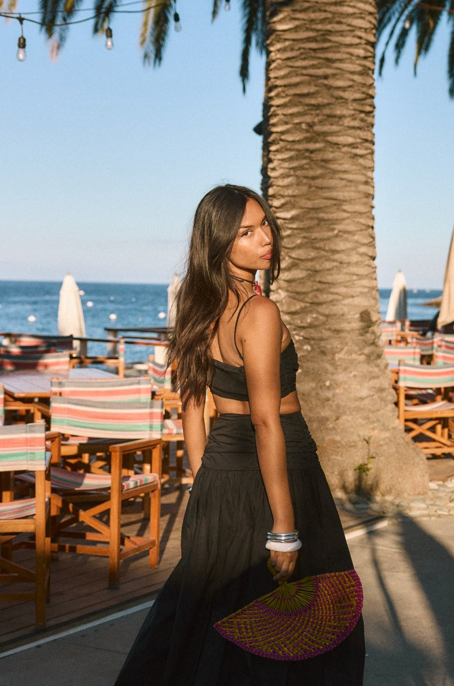 Ruched woven crop top. Adjustable straps. Side zipper closure. Elastic smocked back. Fully lined. black cropped tank top. summer outfit. summer going out top. beach vacation outfit. beach vacation top. fancy dinner top. european summer outfit. european summer top. european summer outfit inspo. vacation outfit. black skirt and cropped tank set