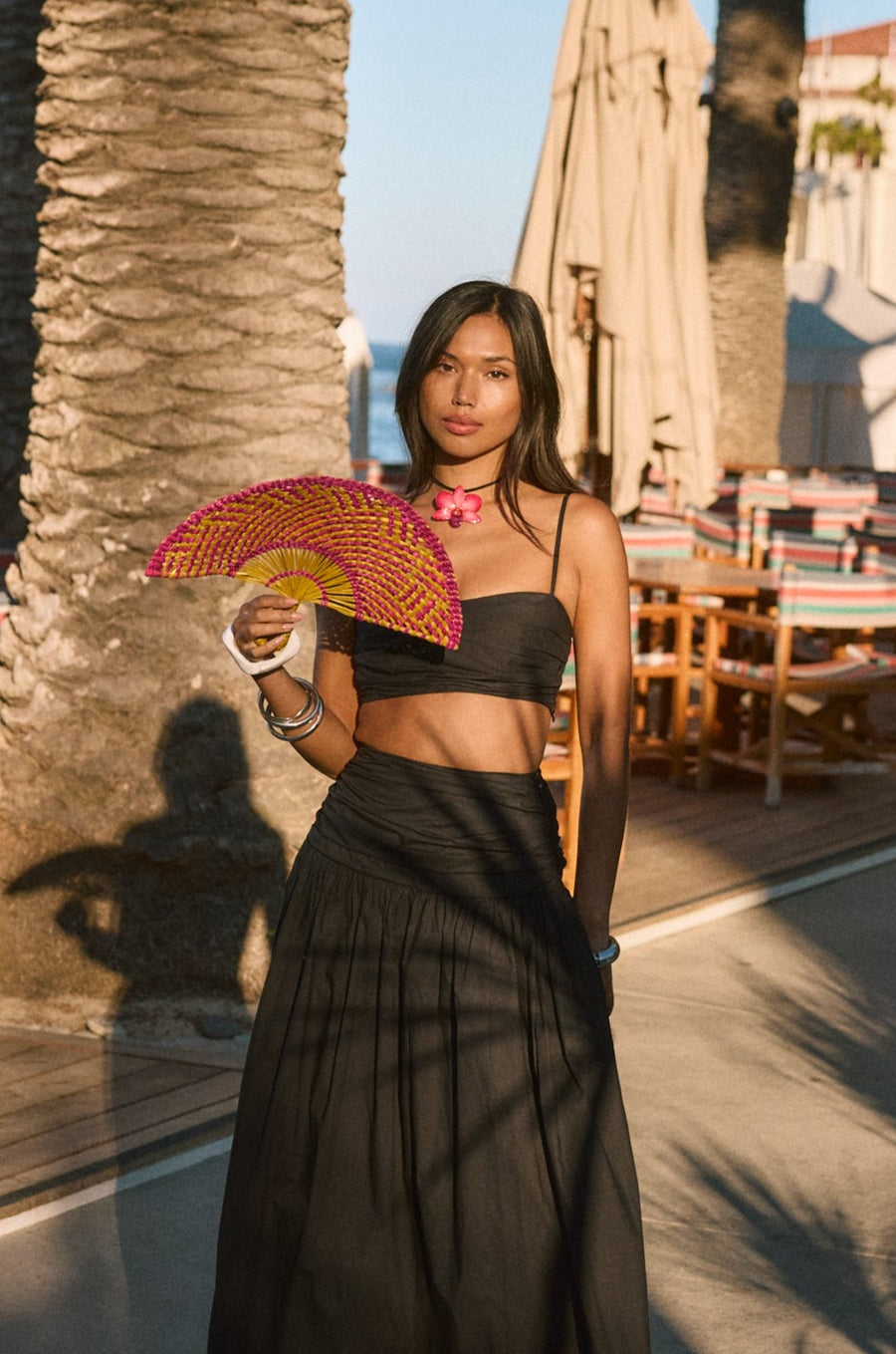 Ruched woven crop top. Adjustable straps. Side zipper closure. Elastic smocked back. Fully lined. black cropped tank top. summer outfit. summer going out top. beach vacation outfit. beach vacation top. fancy dinner top. european summer outfit. european summer top. european summer outfit inspo. vacation outfit. black skirt and cropped tank set