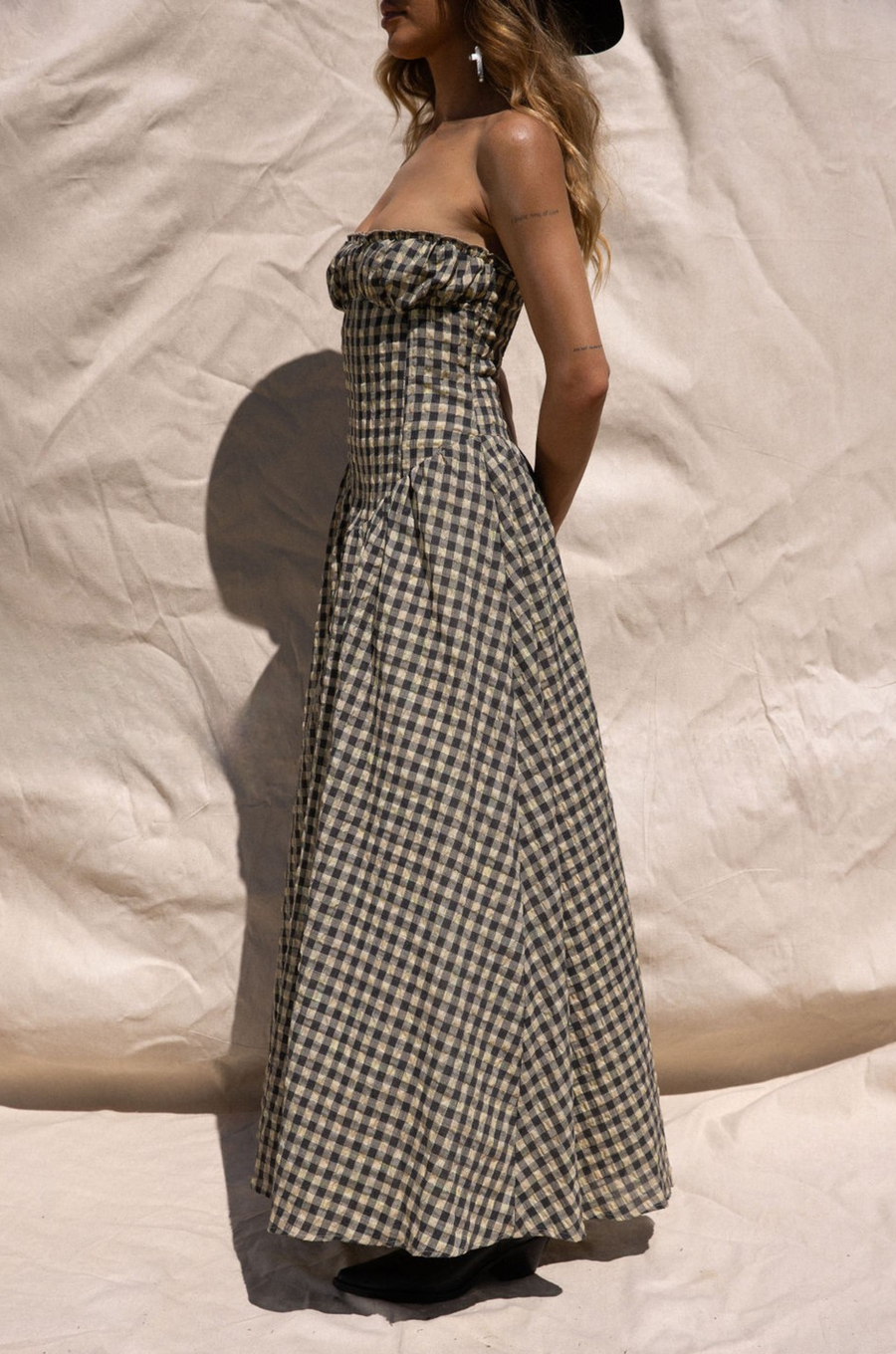 Plaid woven maxi dress. Elastic strapless neckline. Inner rubber grip lining. Elastic smocked back panel. Back hook and eye and zipper closures. Fully lined. Paid maxi dress. ranch outfit. western outfit. stagecoach dress. country concert dress. festival outfit