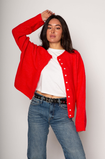 red Fuzzy knit oversized cardigan. Crewneck. Front button down closures. Long sleeves. Unlined.