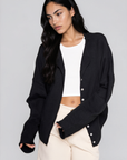 Fuzzy knit cardigan
Crewneck
Front button down closures
Long sleeves
Unlined
black basic cardigan
fall cardigan
fall sweater
fall outfit