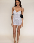 White Polka dot triangle tank top
V-neckline
Ruched bodice
Faux front tie
ruffle trim
summer tank top
spring tank top