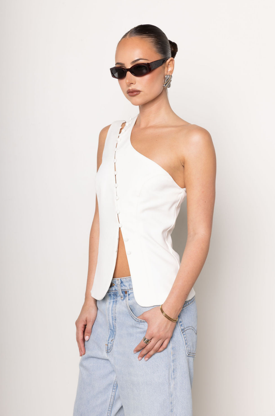 One shoulder button up top
Button down closure
Sleeveless
white one shoulder top
going out top