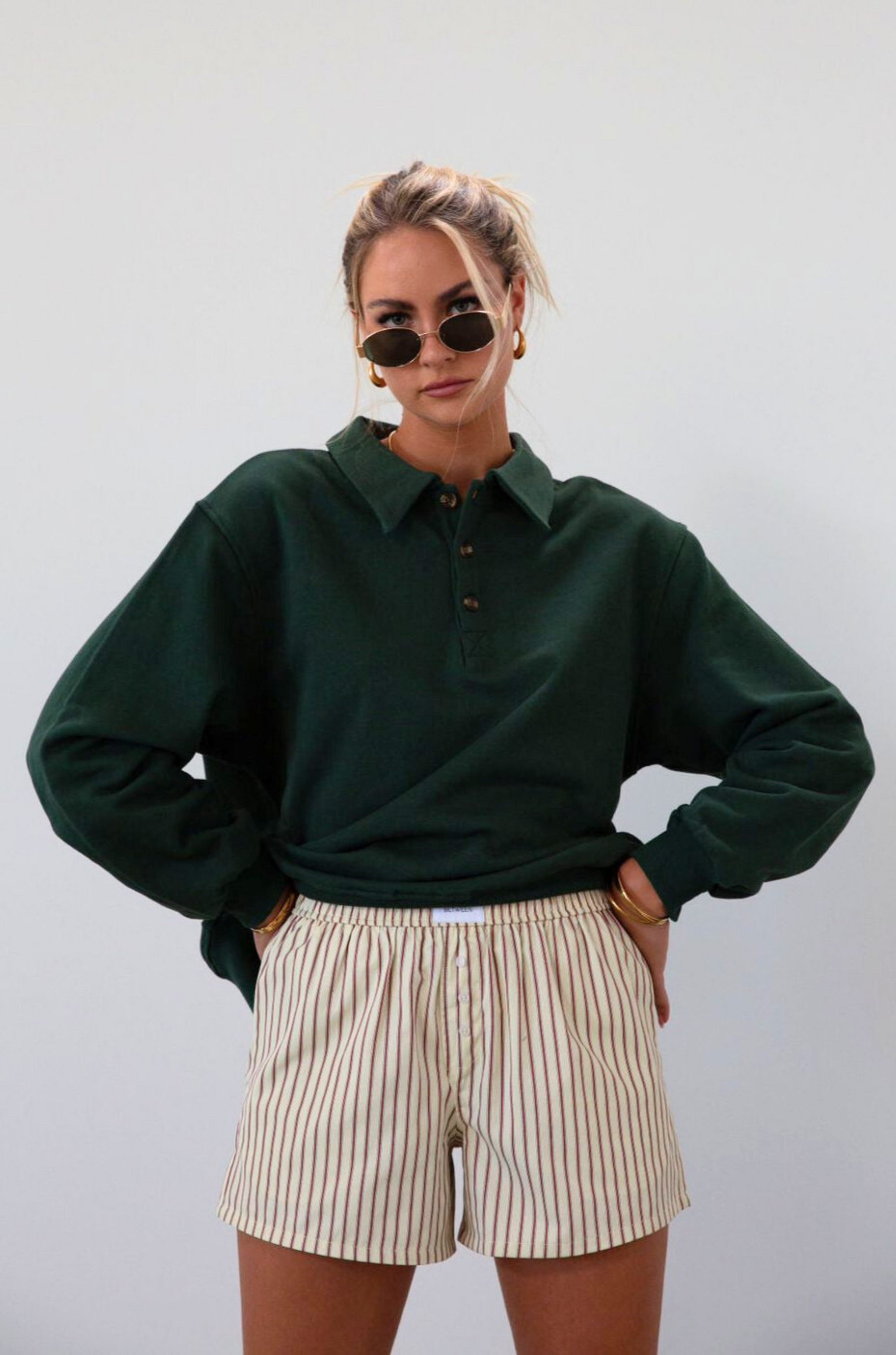 Knit top. Collar neckline. Front button down closure. Unlined. green sweatshirt. fall outfit. fall top. fall transition. cute casual outfit.