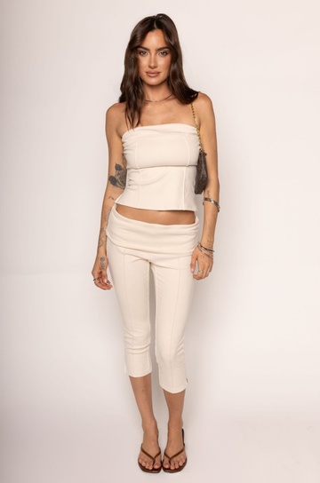 TOP

Tube top
Sweater material
Unlined
Length: 14"
Polyester/Spandex

BOTTOM

Capri pant
Sweater material
Fold over
Length: 28.5"
Polyester/Spandex

cream tube top and capri pant set