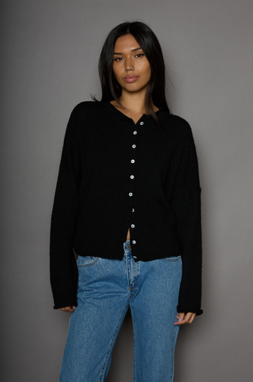 Fuzzy knit cardigan. Crewneck. Front button down closures. Long sleeves. Unlined. black cardigan. fall outfit. fall cardigan. layering piece. layering cardigan