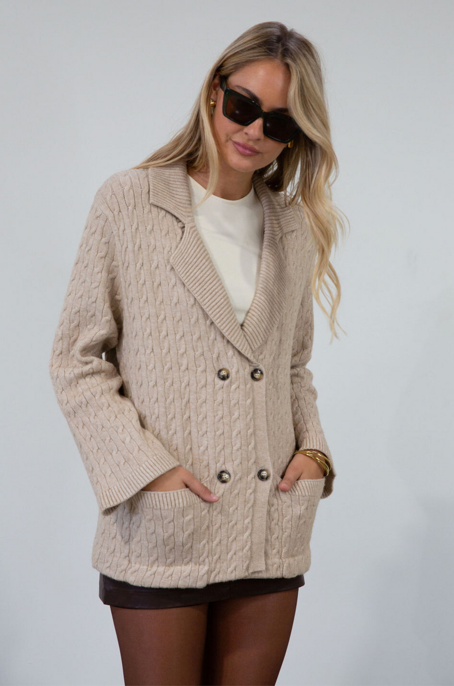 Cable knit cardigan. Double breasted. Collar neckline. Front button down closure. Front pockets. Unlined. oat cardigan sweater. fall sweater. fall outfit