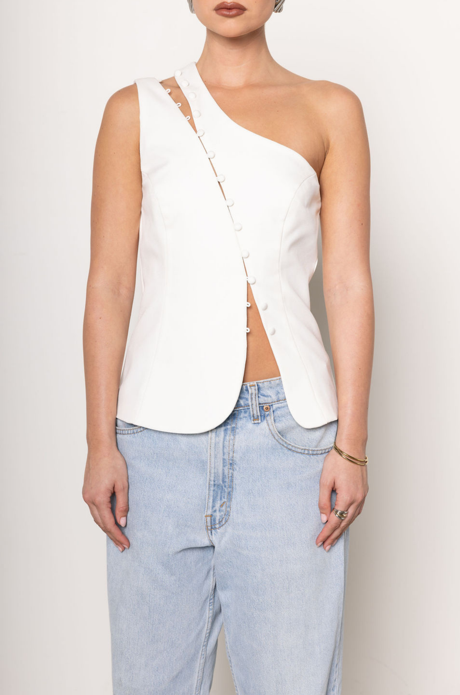 One shoulder button up top
Button down closure
Sleeveless
white one shoulder top
going out top