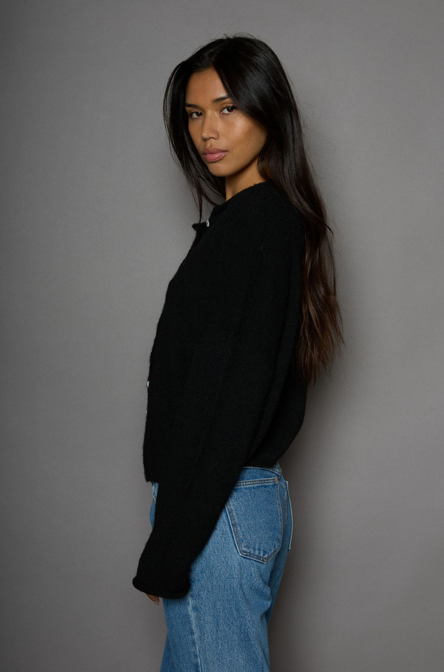 Fuzzy knit cardigan. Crewneck. Front button down closures. Long sleeves. Unlined. black cardigan. fall outfit. fall cardigan. layering piece. layering cardigan