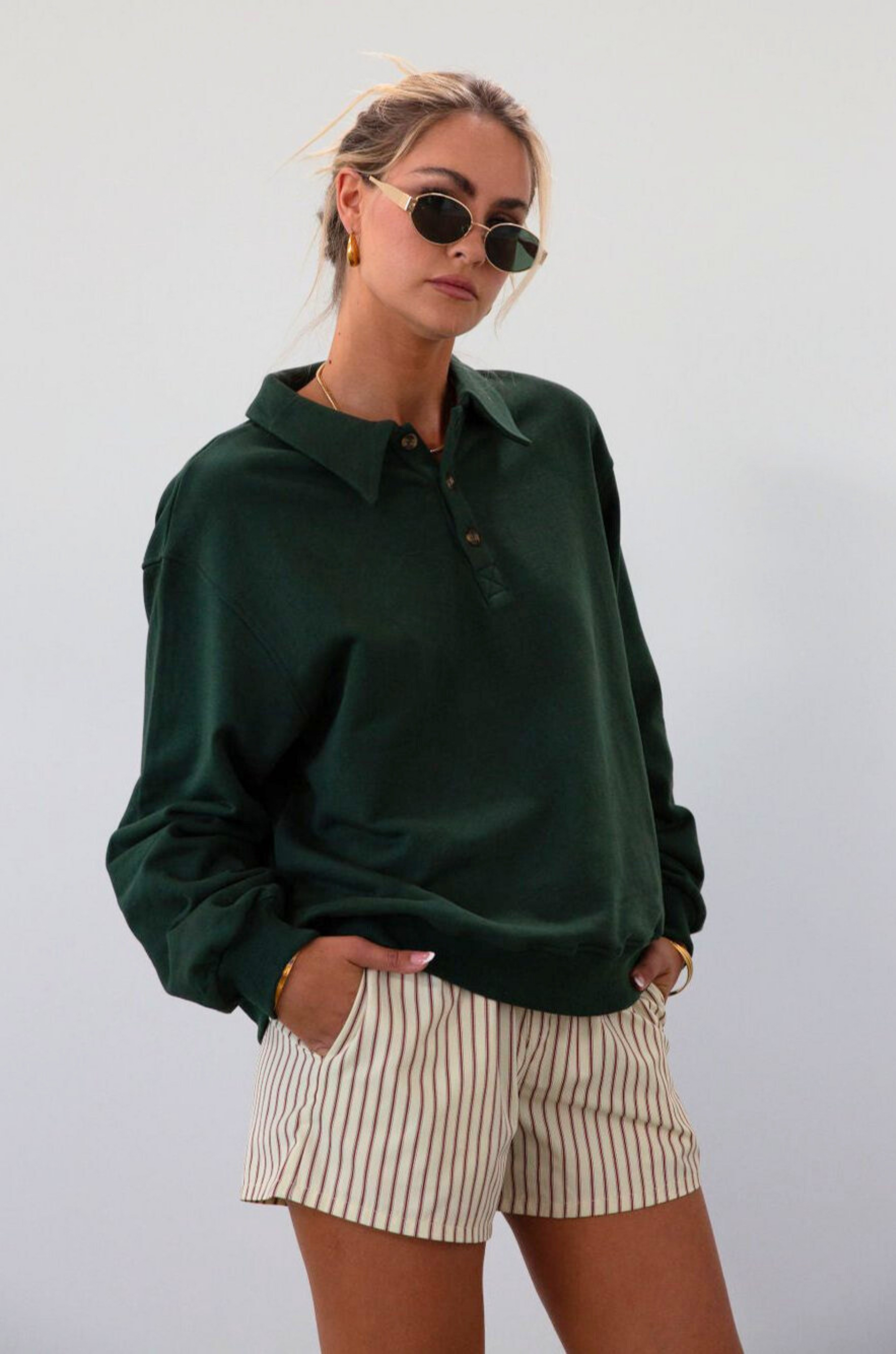 Knit top. Collar neckline. Front button down closure. Unlined. green sweatshirt. fall outfit. fall top. fall transition. cute casual outfit.