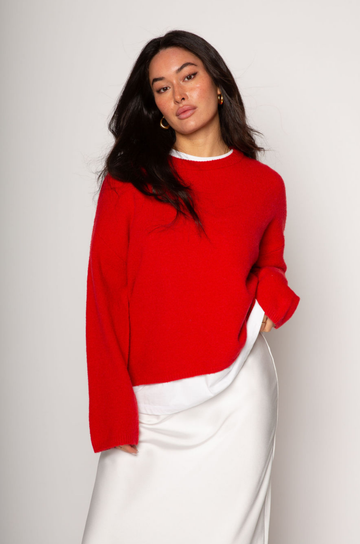 Medium weight knit sweater. Crewneck. Long sleeves. Thin ribbed trim detail at collar, sleeve cuffs, and hemline. Unlined. Pullover style. red pullover sweater. valentines day outfit