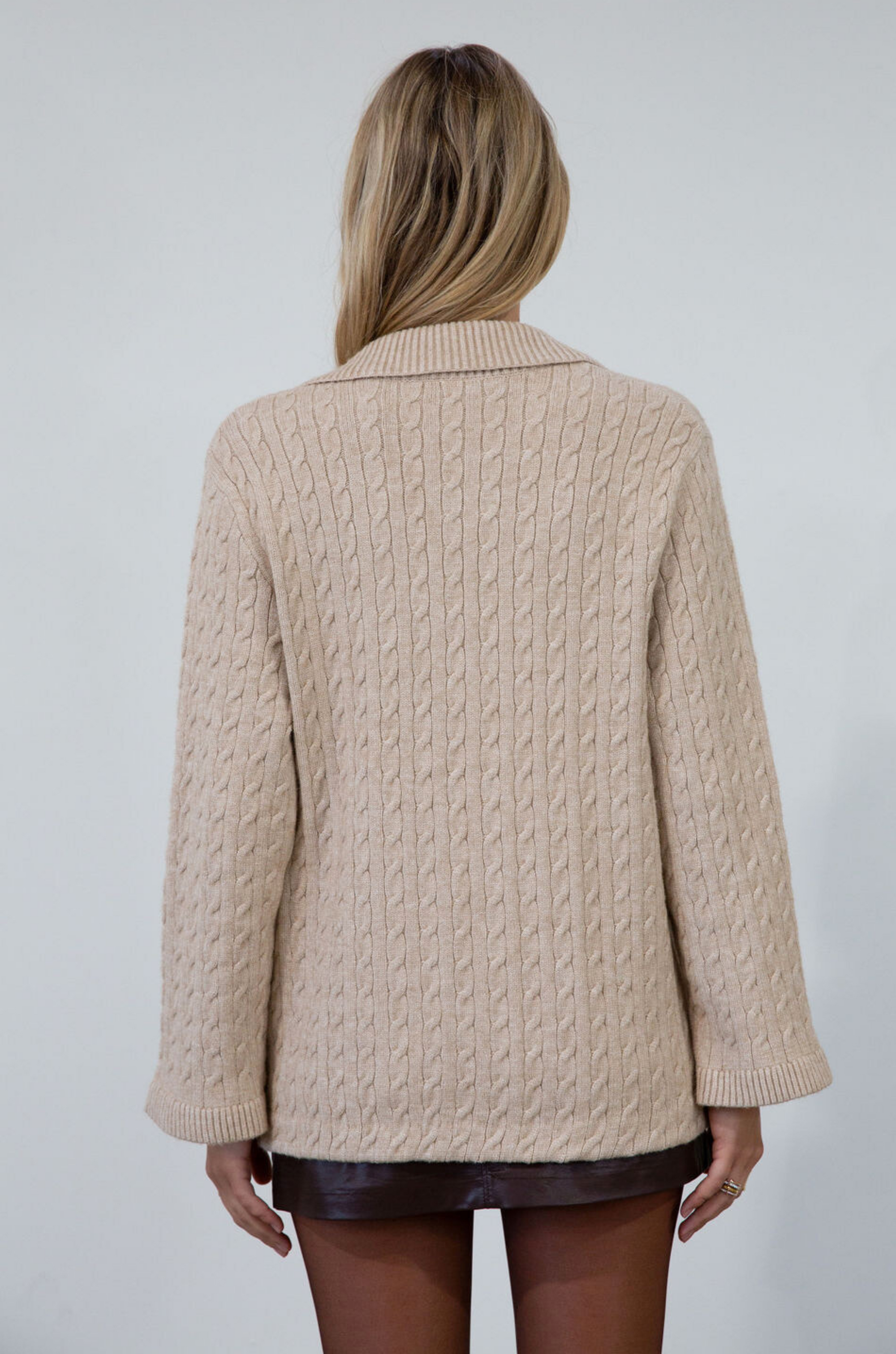 Cable knit cardigan. Double breasted. Collar neckline. Front button down closure. Front pockets. Unlined. oat cardigan sweater. fall sweater. fall outfit