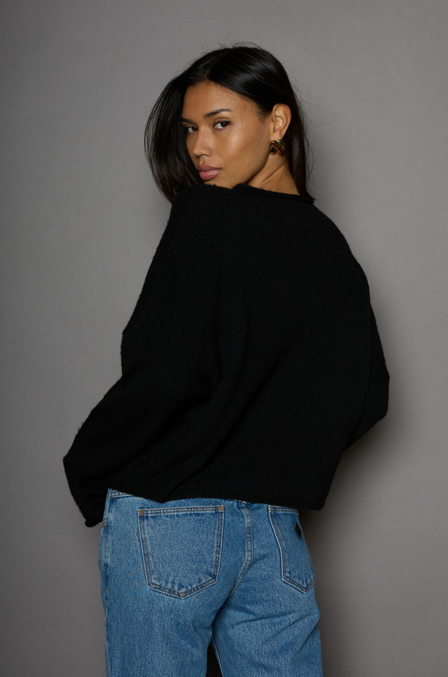 Fuzzy knit cardigan. Crewneck. Front button down closures. Long sleeves. Unlined. black cardigan. fall outfit. fall cardigan. layering piece. layering cardigan