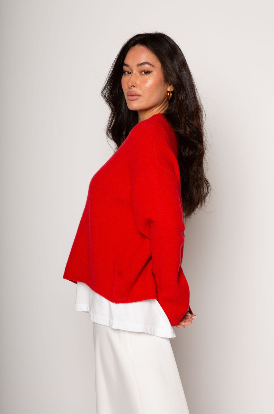 Medium weight knit sweater. Crewneck. Long sleeves. Thin ribbed trim detail at collar, sleeve cuffs, and hemline. Unlined. Pullover style. red pullover sweater. valentines day outfit