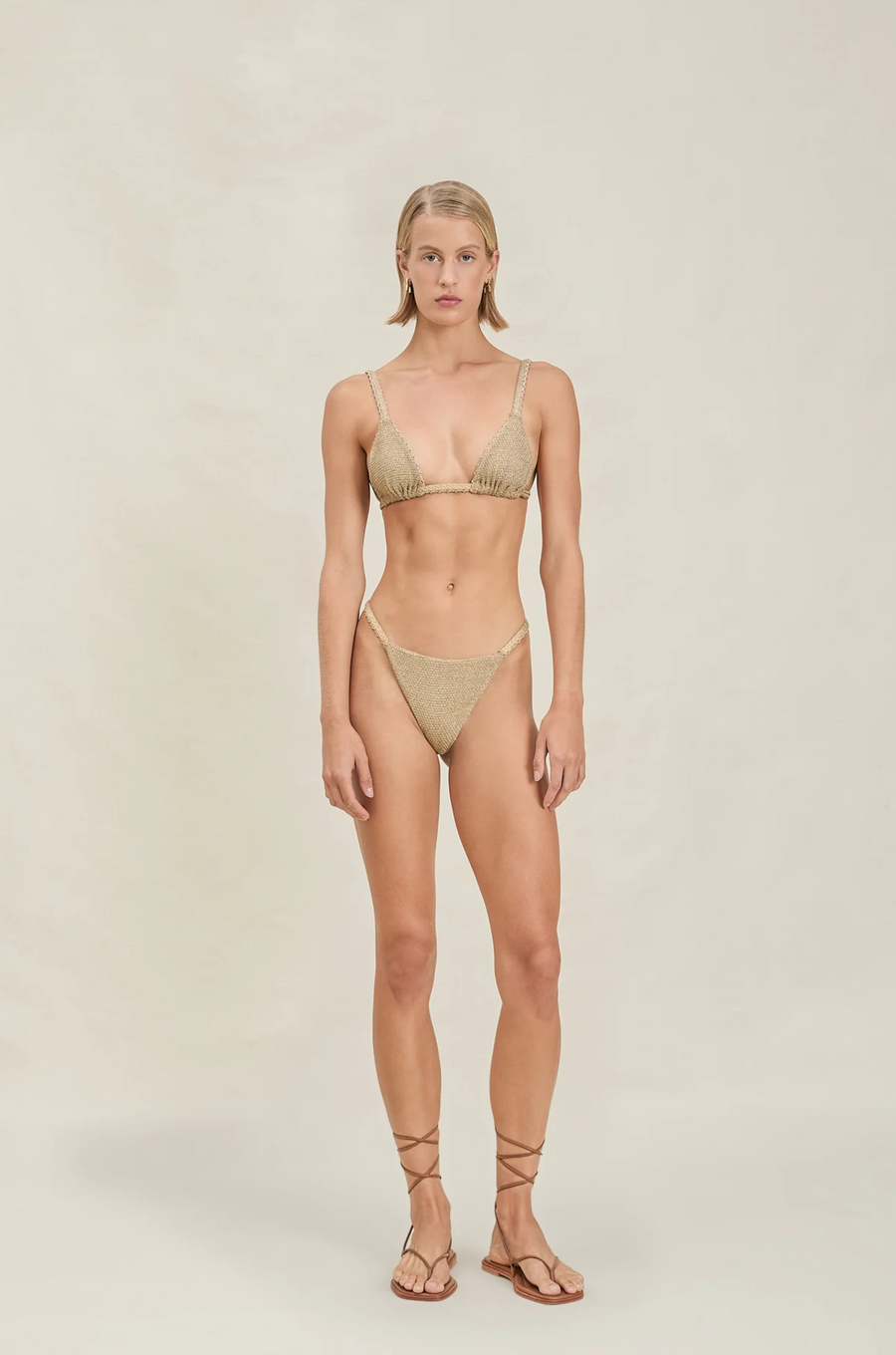 Triangle metallic bikini top
Adjustable straps
Shimmer detailing
gold bikini top