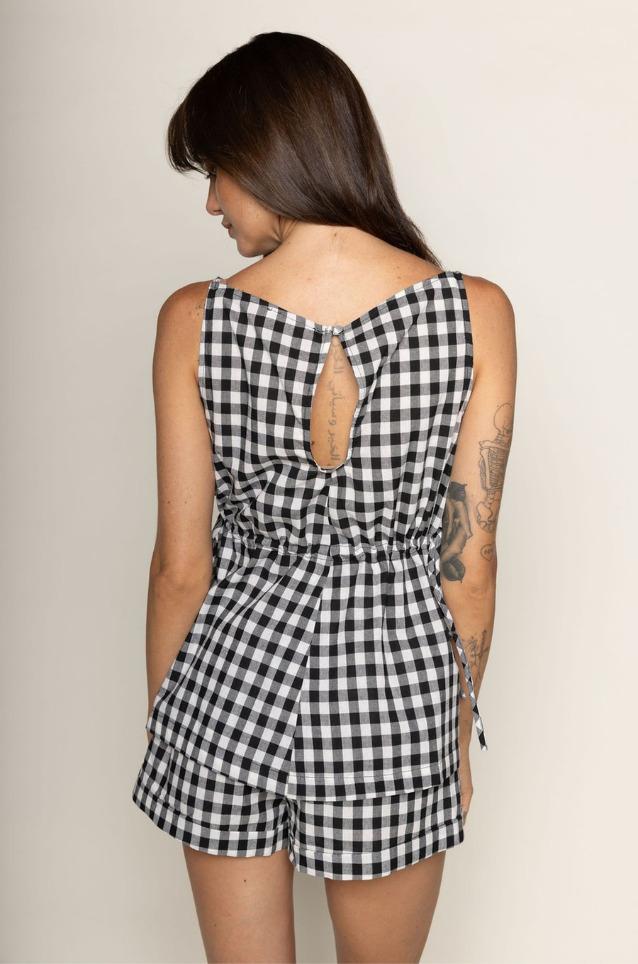TOP:
Gingham printed flowy tank top
Ruched side ties
Back button closure
Unlined
Length: 21"
Cotton

BOTTOM:
Gingham printed shorts
Elastic waistband
Unlined
Length: 11.5"
Cotton

black and white gingham printed short set
summer set