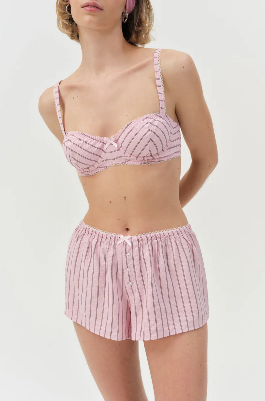 pink Striped unlined bra
Underwire cups
Adorned with picot trims
Decorative bow at front
Adjustable straps
pink bra
for love & lemons bra