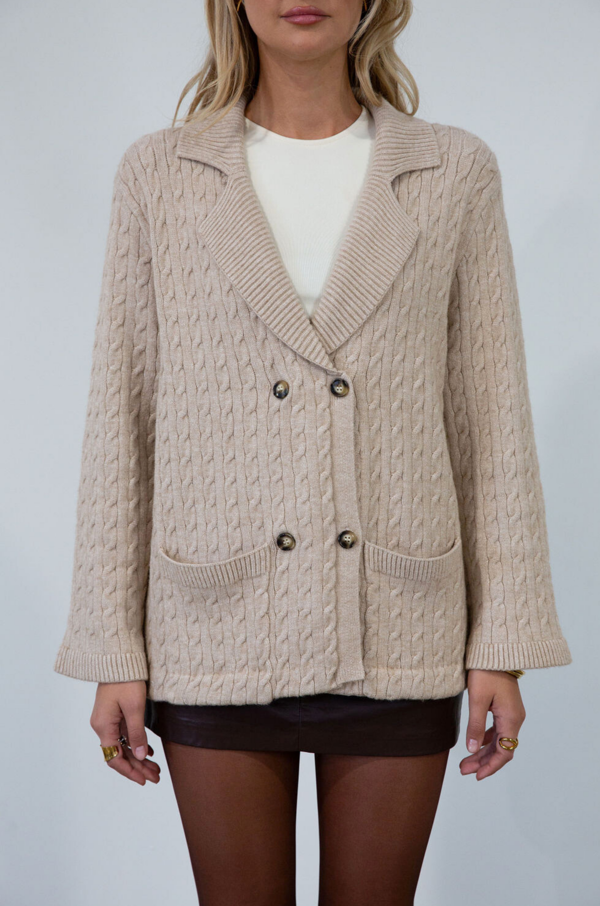 Cable knit cardigan. Double breasted. Collar neckline. Front button down closure. Front pockets. Unlined. oat cardigan sweater. fall sweater. fall outfit
