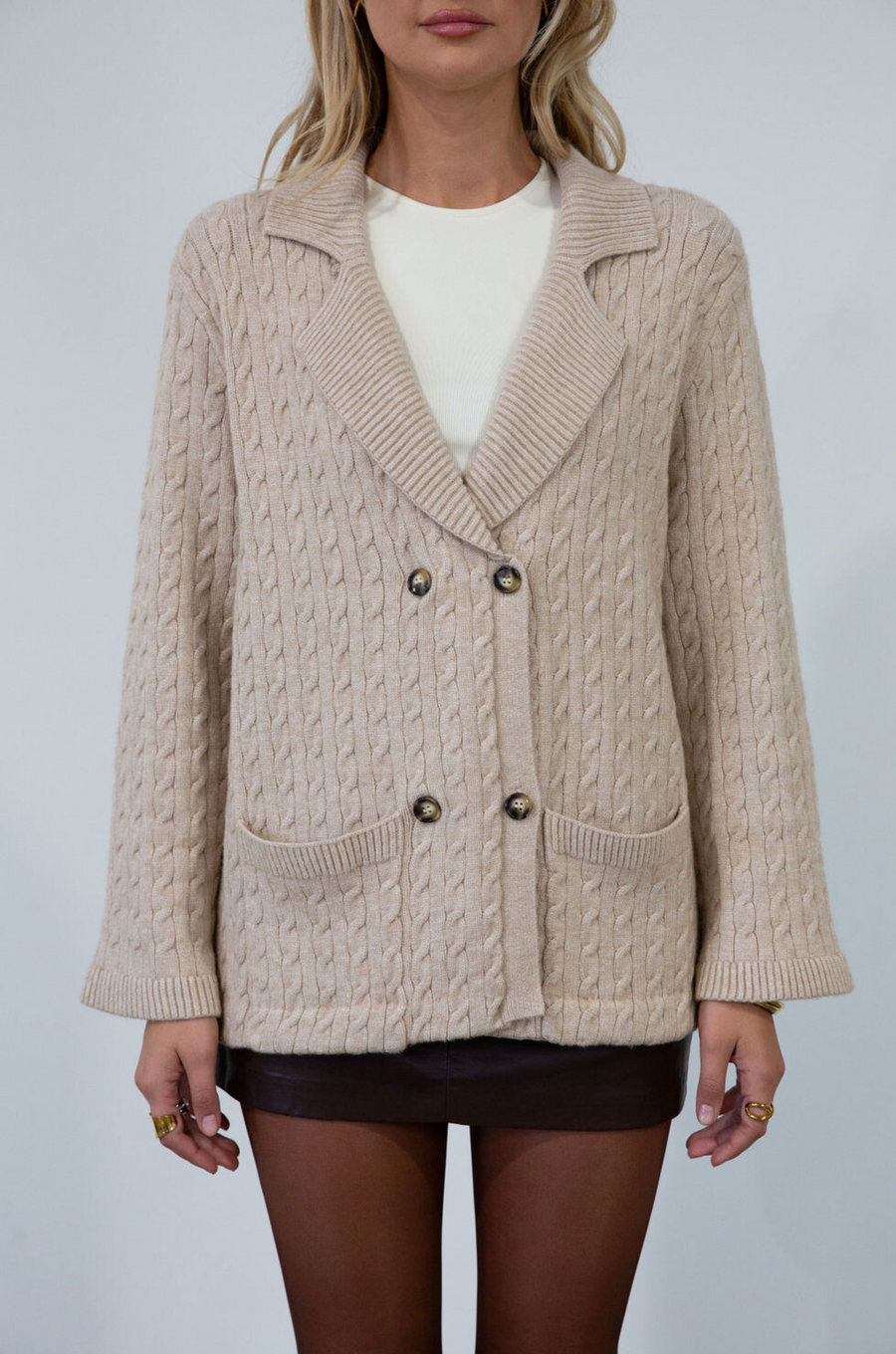 Cable knit cardigan. Double breasted. Collar neckline. Front button down closure. Front pockets. Unlined. oat cardigan sweater. fall sweater. fall outfit