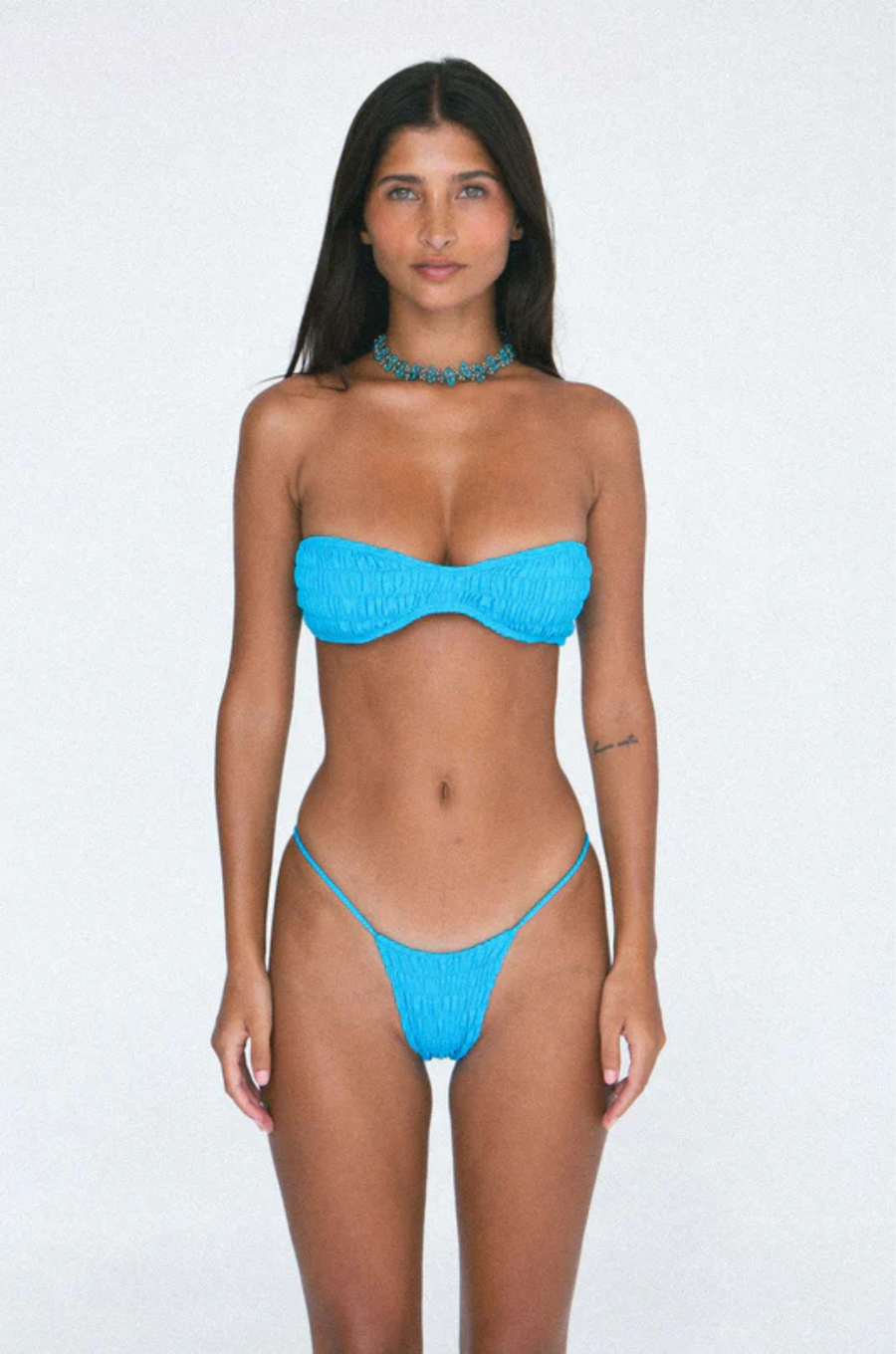 Strapless smocked bandeu bikini top
Silky, buttery-soft matte Italian recycled fabric
Runs small
blue strapless bikini top
blue swimwear
blue bandeau bikini top
resort wear bikini