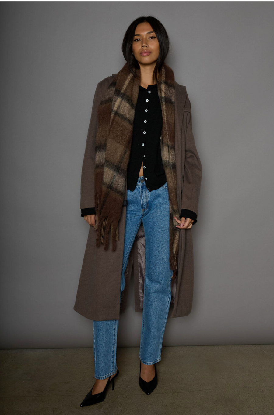 Fuzzy knit cardigan. Crewneck. Front button down closures. Long sleeves. Unlined. black cardigan. fall outfit. fall cardigan. layering piece. layering cardigan