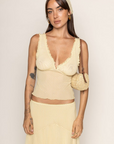 yellow and brown Mesh polka dot tank top with head scarf
V-neck neckline
Ruffle trim
Unlined/sheer
