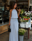 blue Halter maxi dress
Hook and eye clasp neck closure
Open back
Partially lined