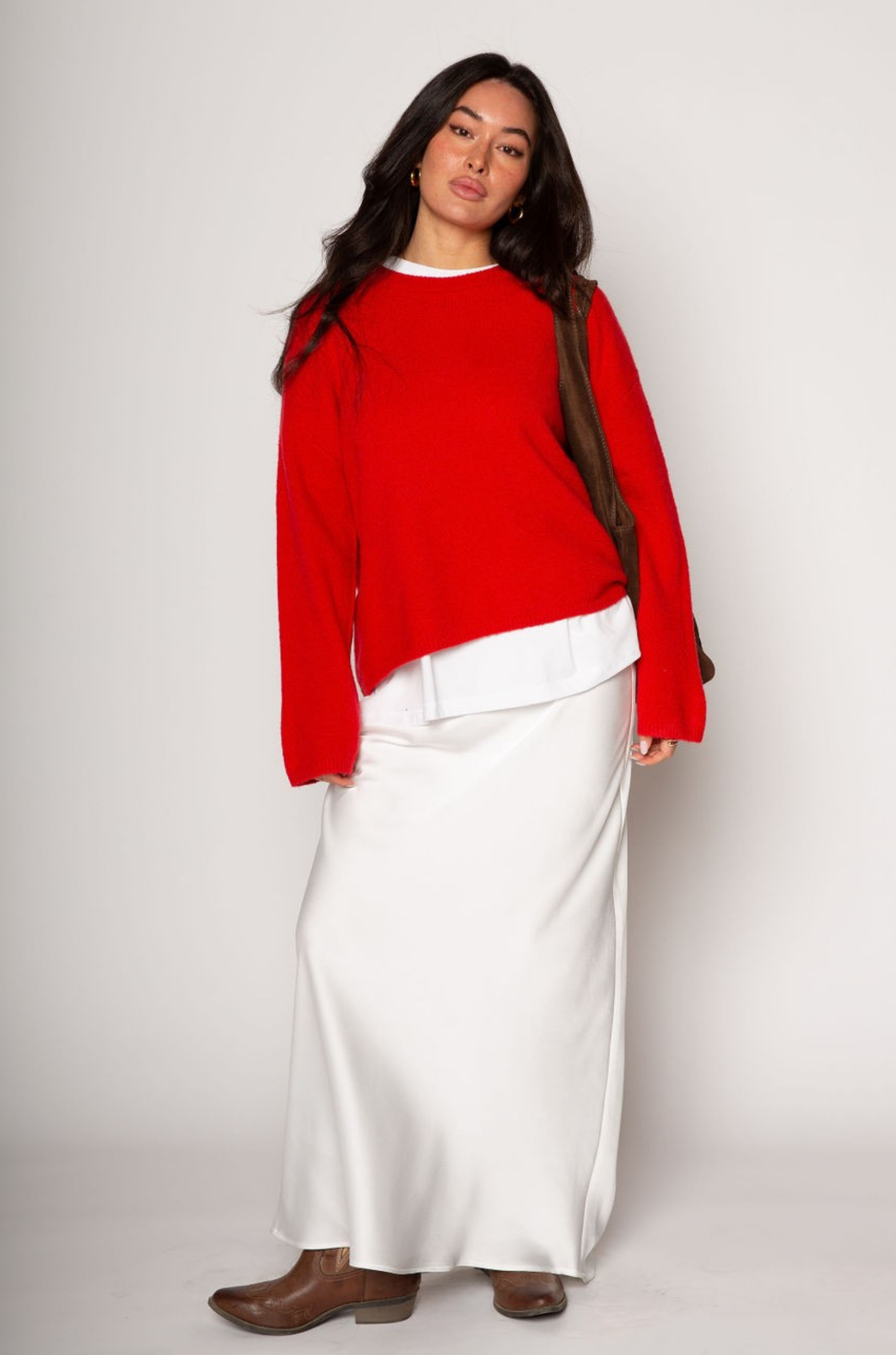 Medium weight knit sweater. Crewneck. Long sleeves. Thin ribbed trim detail at collar, sleeve cuffs, and hemline. Unlined. Pullover style. red pullover sweater. valentines day outfit