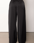black Satin pull on pants
Adjustable drawstring waistband
Elastic waistband
Side pockets
Unlined
Length: 40"
Polyester
fall pants
fall bottoms
fall outfit