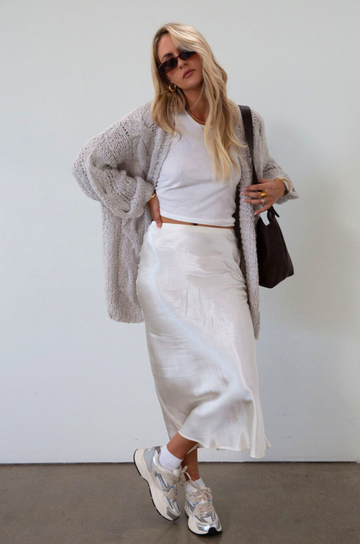 Satin maxi skirt. Elastic waist. Side hook and eye and zipper closures. Unlined. cream maxi skirt. satin maxi skirt. fall outfit. 