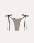 Exclusively from the JENNIE x Frankies Bikinis collaboration.
Reversible design: animal print on one side, striped print on the other bikini bottom
Low-rise fit
Cheeky coverage
String side ties
Satin shine swim fabric
Nylon/Spandex