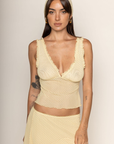 yellow and brown Mesh polka dot tank top with head scarf
V-neck neckline
Ruffle trim
Unlined/sheer