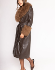 brown Midi-length faux leather coat
Straight silhouette with a wrap front
Belt to cinch the waist
Shearling trims the oversized collar and wide cuffs
Button down closure
Lined
leather coat with fur trim
Aspen vibes