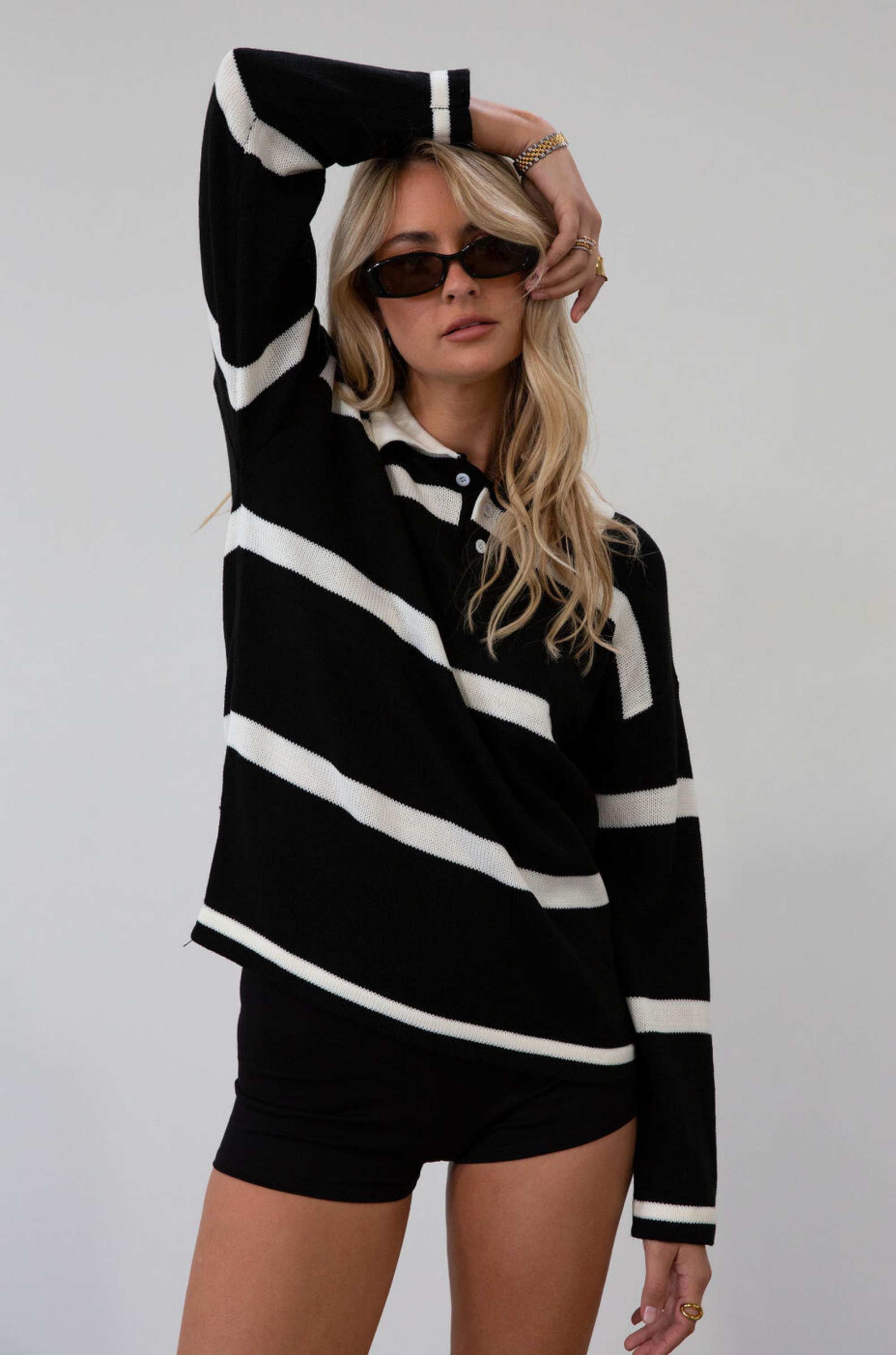 Fuzzy crochet knit striped sweater. Collar neckline. Front button closures. Unlined. fall top. fall outfit. fall sweater. striped polo sweater