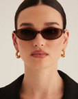 brown Oval sunglasses
Gold hardware engraved with Banbé logo on outer left arm
Scratch resistant/category 3/polarised lens
100% UV protection
Acetate frame
Width: 10.4cm / Lens Height: 3cm / Arm Length: 14cm / Nose Bridge: 1.9cm