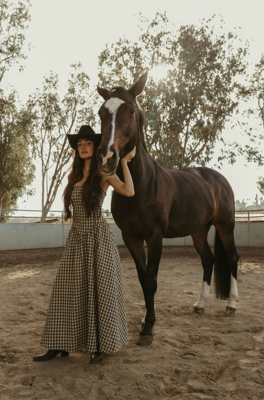 Plaid woven maxi dress. Elastic strapless neckline. Inner rubber grip lining. Elastic smocked back panel. Back hook and eye and zipper closures. Fully lined. Paid maxi dress. ranch outfit. western outfit