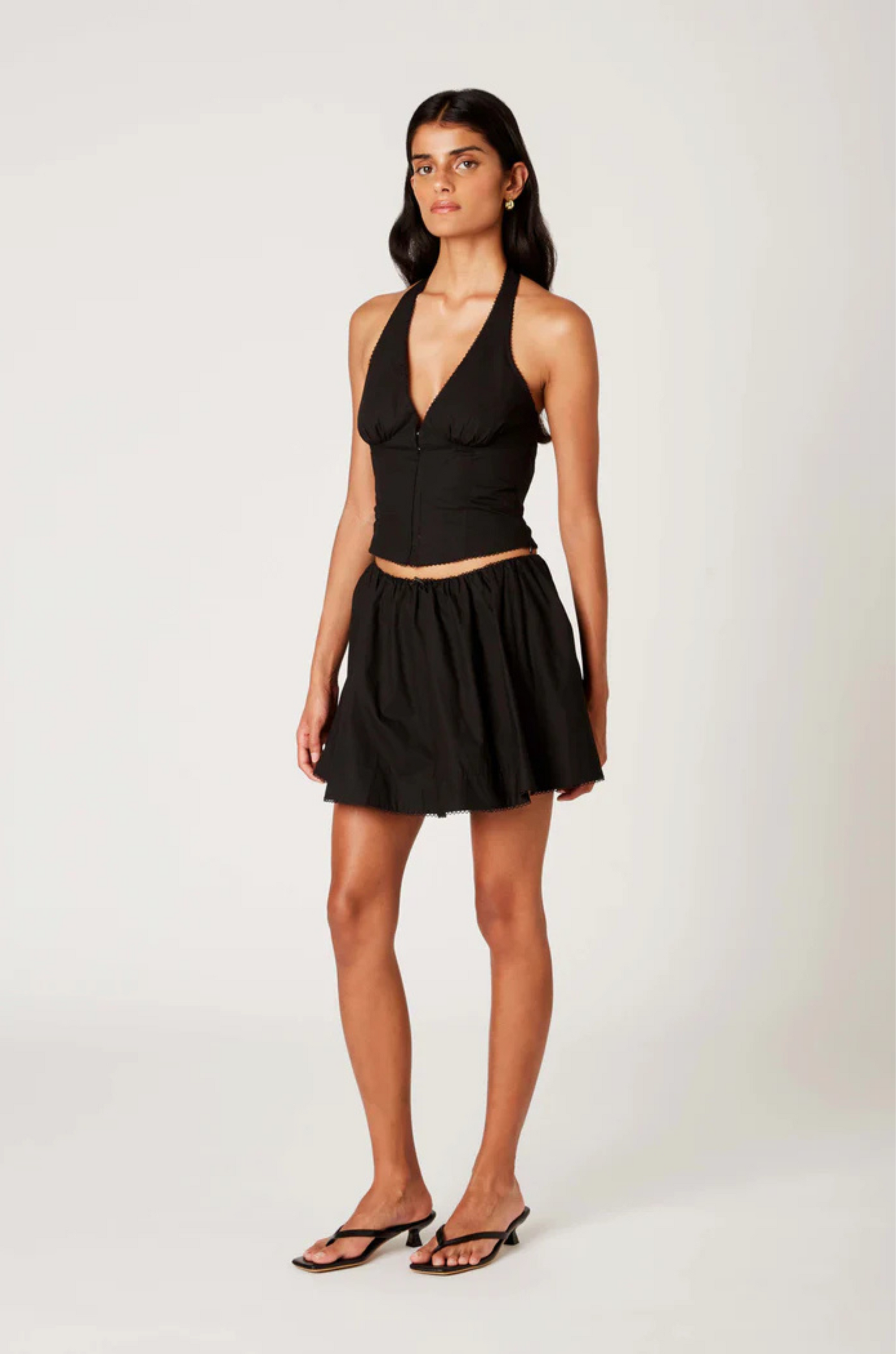 black Poplin halter corset top
Deep V neckline
Scallop edge trim
Hook & eye detail at front
Side zipper closure
Lined