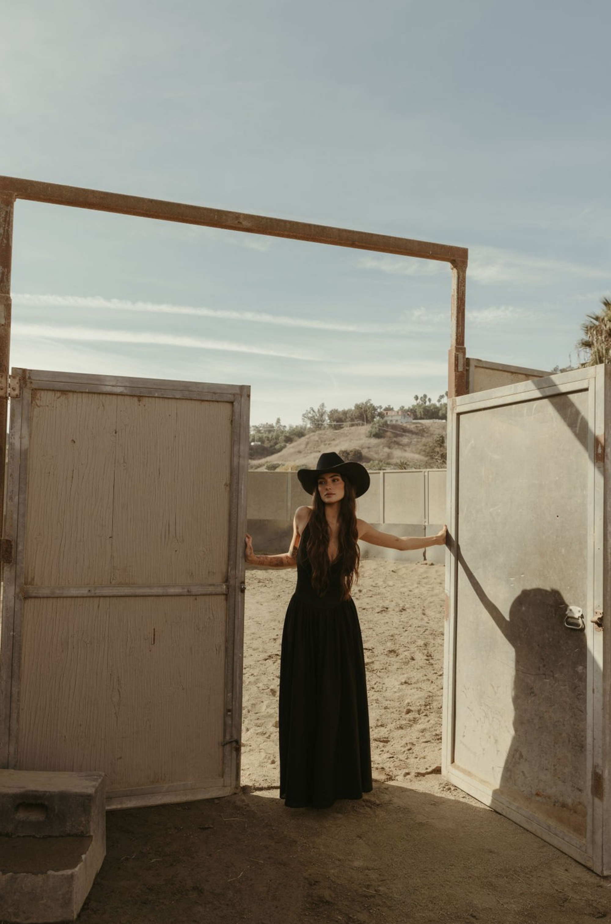 Woven maxi dress. Adjustable crisscross back straps. Back hook and eye and zipper closures. Fully lined. black maxi dress. country outfit. country dress. western outfit. western dress.