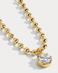 Delicate ball chain necklace anchored with a luminous CZ pendant
14kt gold plated brass&nbsp;or Rhodium plated brass
Stone is a white cz and measures 8.0mmNecklace measures 16" with a 3" extender
Lobster Clasp Closure
Gold chain necklace