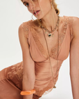 Ruched satin bodice tank top
Smocked backing
Lace trim throughout
V-neckline
Triangle cups
Full length
Asymmetrical hem
peach satin lace tank top