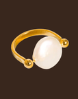 Gold ring with a large pearl
18K Gold Non-Tarnish Baroque Pearl Ring
18K Gold Plating
Stainless Steel
Faux Pearl
Size 7 Measurement: 0.682 Diameter/2.14 Circumference
Lead-free
Nickel-safe
Hypoallergenic
Water Resistant