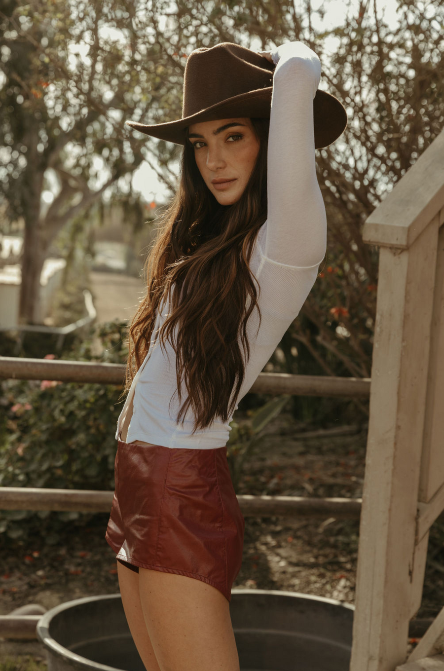 Faux leather shorts. Back hook and eye and zipper closures. Fully lined. red leather shorts. red hot shorts. mini red leather shorts. 