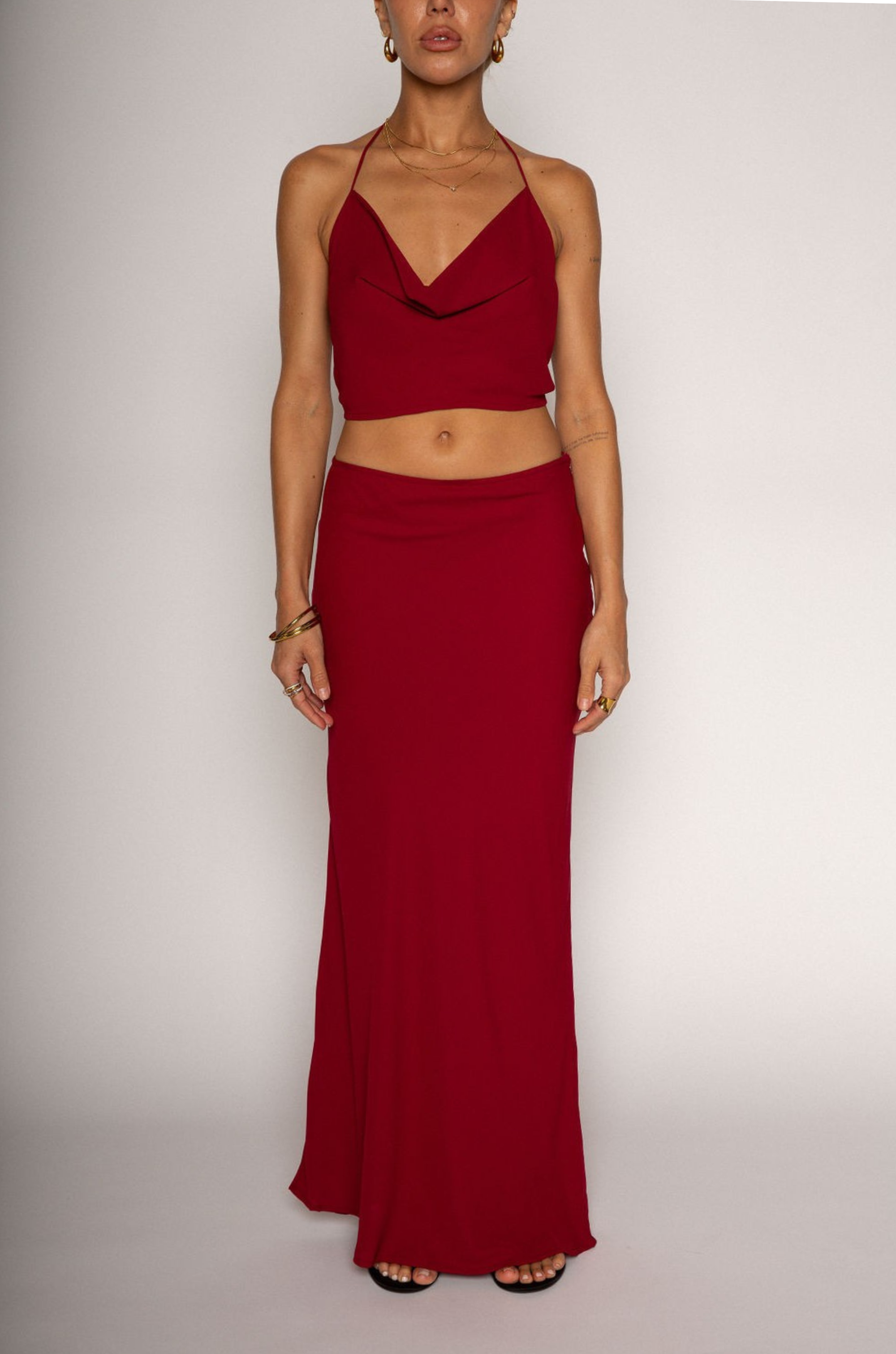 Halter crop top. Adjustable neck and back tie strap. Cowl neck. Partially lined. Maxi skirt. Hidden side zipper. Lined. red skirt set. cherry red skirt set. going out set. nice dinner set. summer outfit. spring outfit.