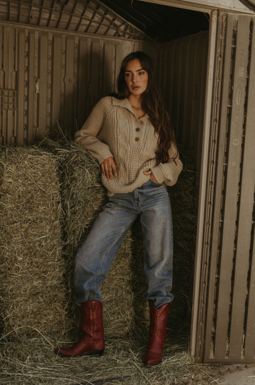Fuzzy mixed knit crochet sweater. Collar neckline. Front button closures. Long sleeves. Banded hems. Unlined. tan sweater. knit sweater. quarter button up sweater