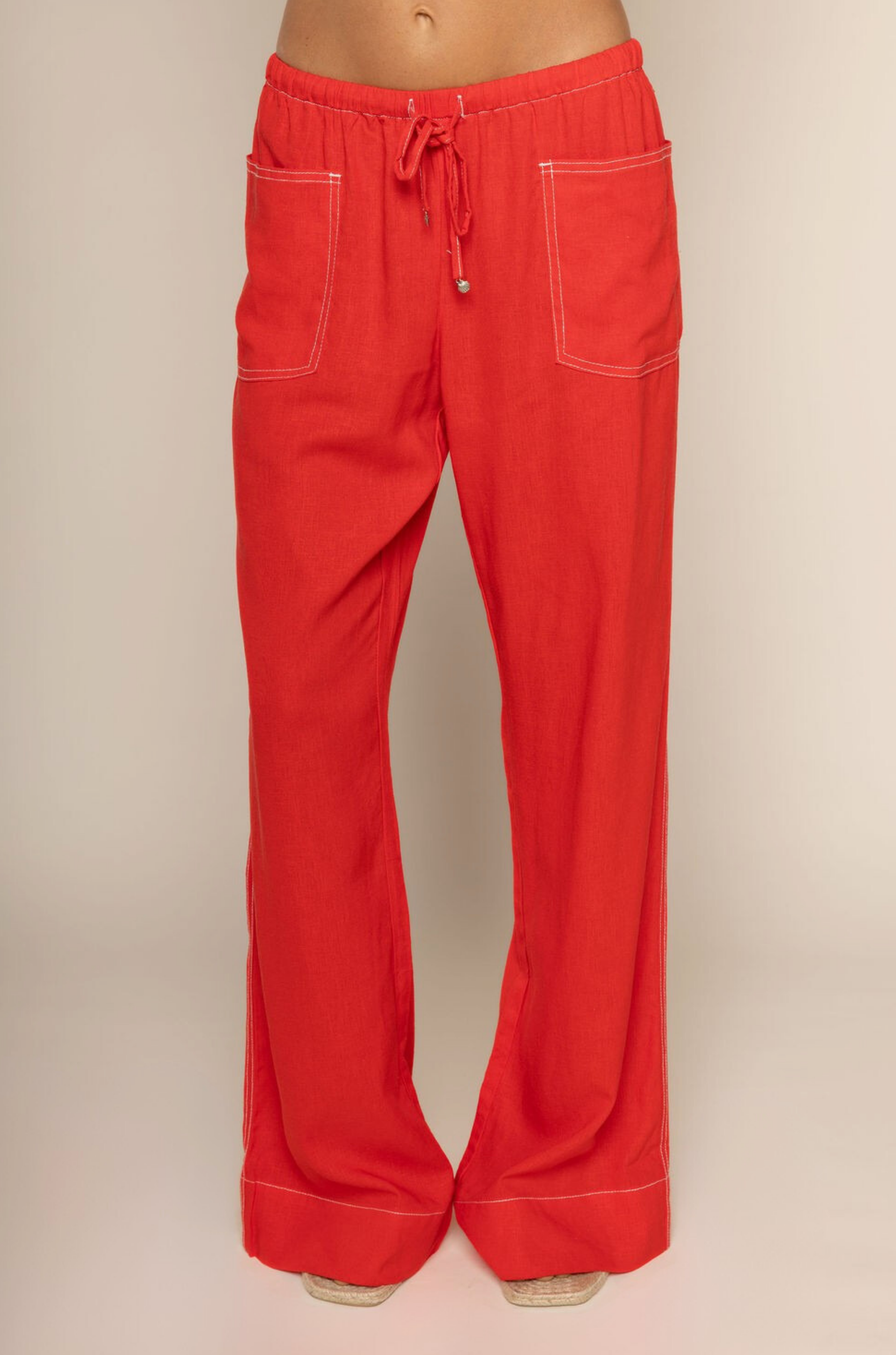 red Linen pants
Elastic adjustable drawstring waistband
White contrast stitching
2 front pockets
Unlined
red cover up pants
swim cover up
fourth of july swim cover up