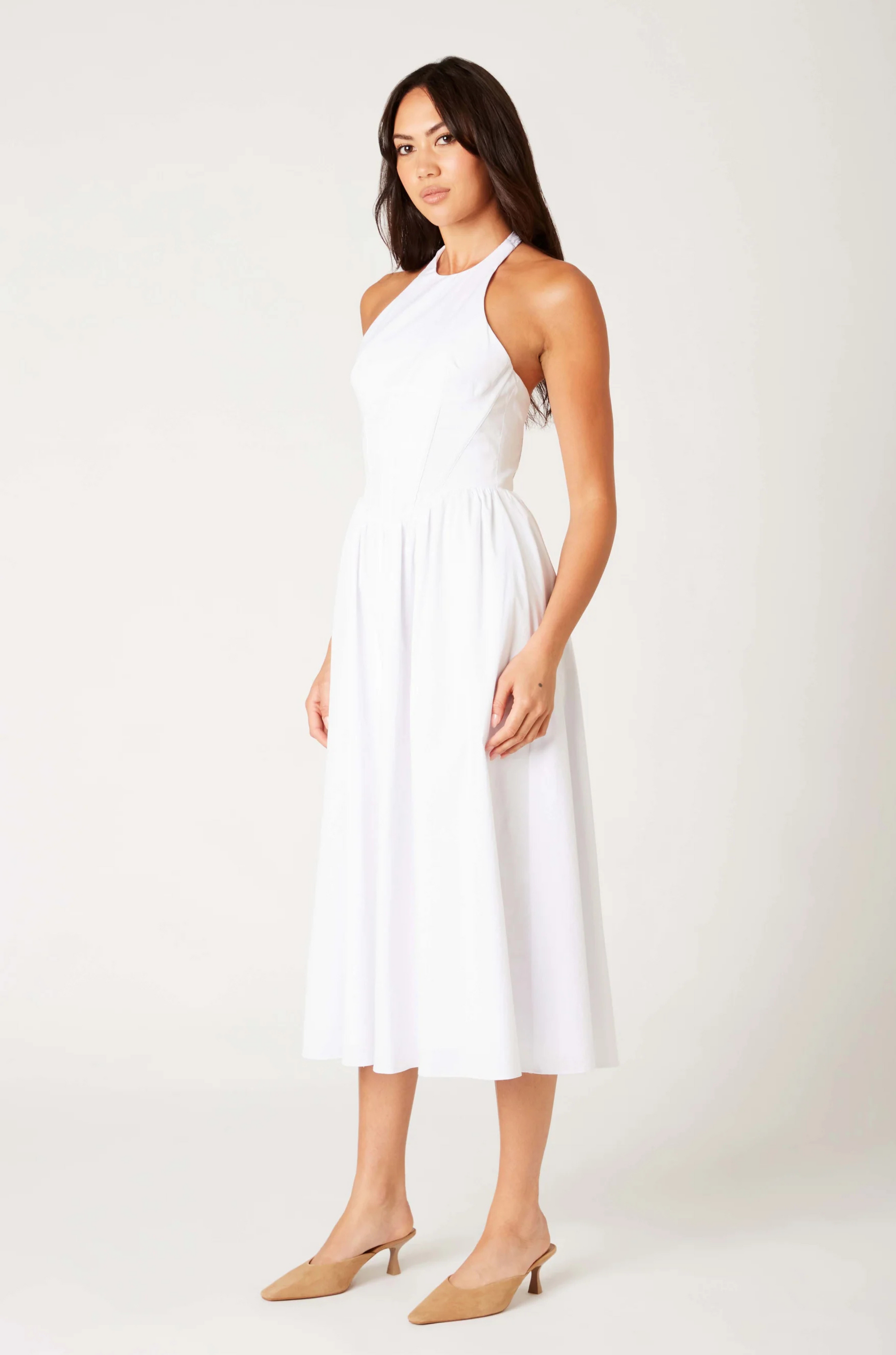 Woven midi dress
Adjustable halter neckline
Boning in bodice
Side pockets
Elastic back neckline
Back hook and eye and zipper closures
Fully lined
white midi dress
bridal dress
bridal shower dress