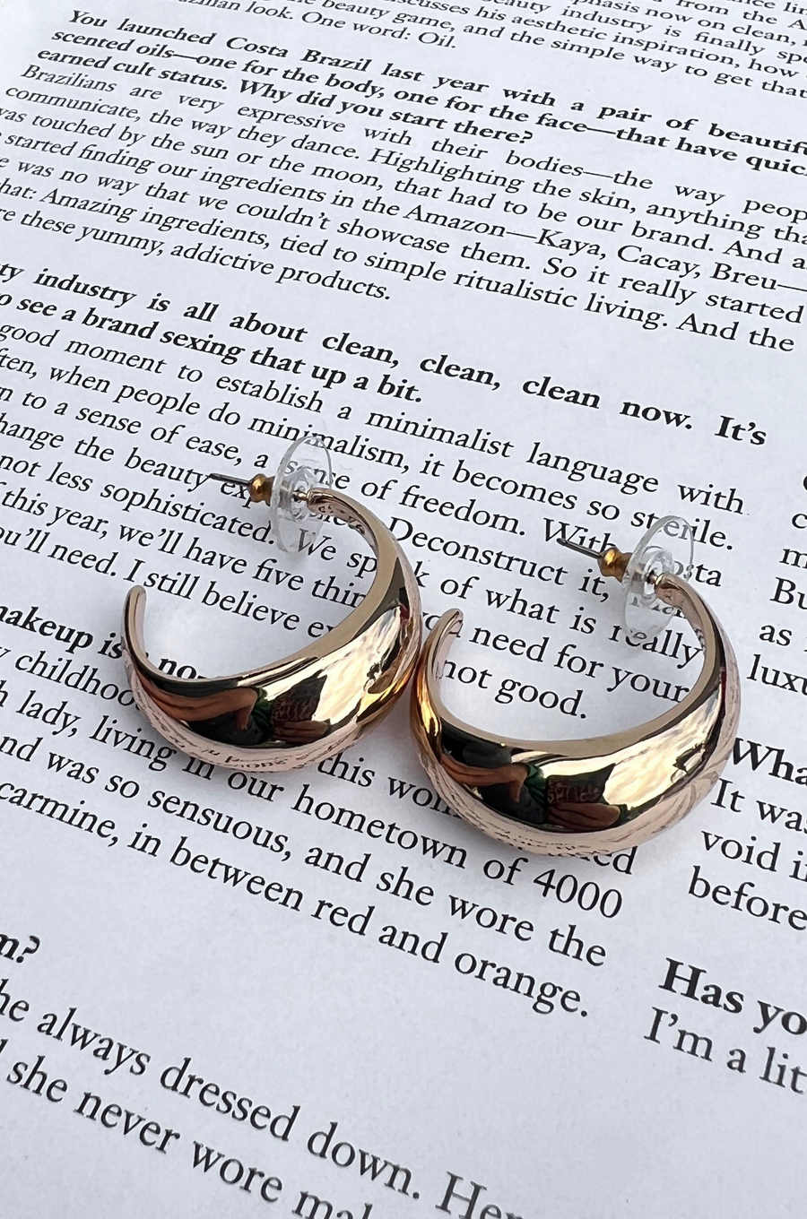 Open hoop gold earrings Post back.