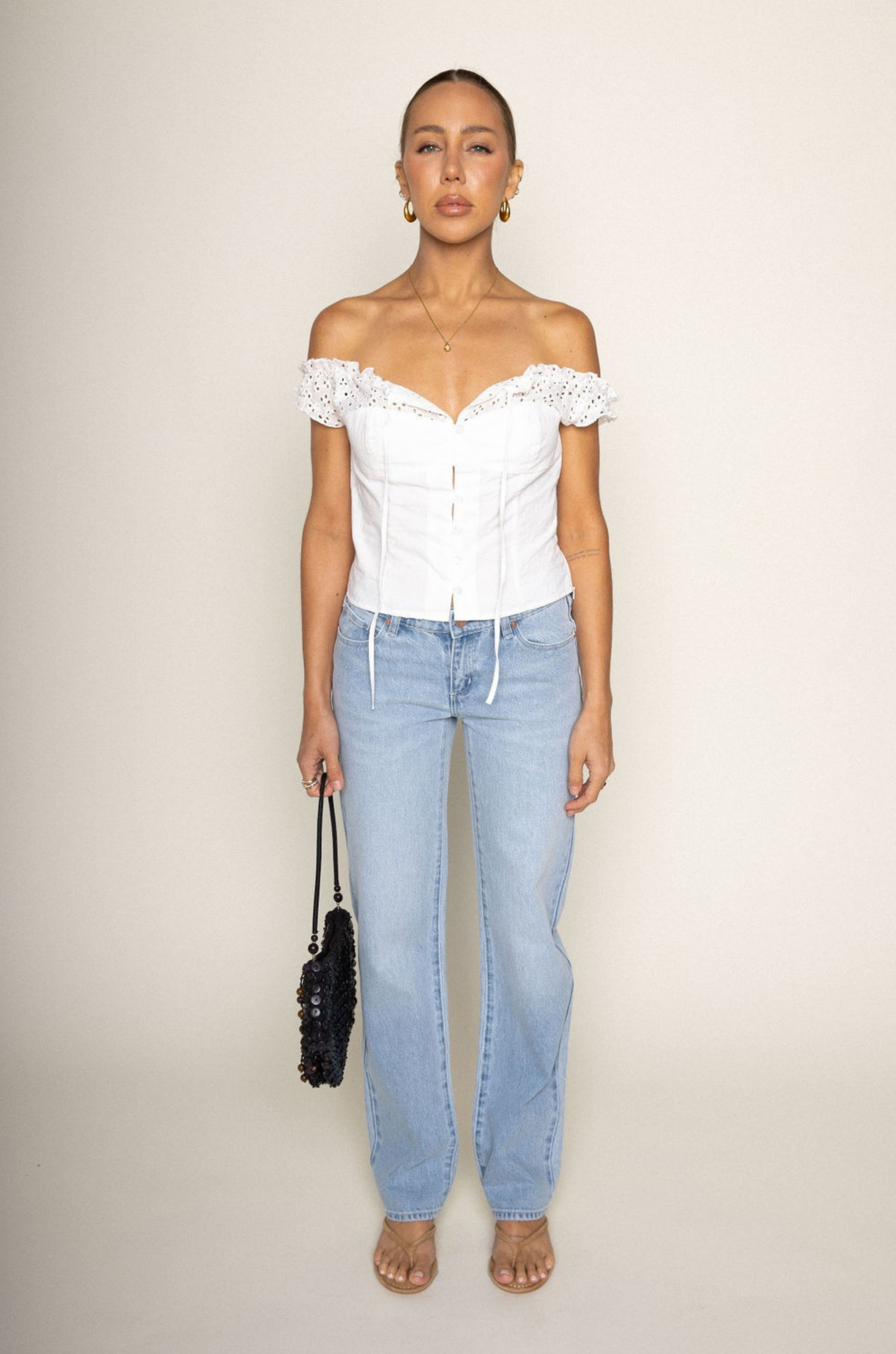 white Woven eyelet off the shoulder top
Button down closure
Faux front tie
Unlined
summer top
spring top