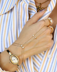 Two bezel-set cubic zirconia stones hand chain
This ultra-sleek, tarnish-free hand chain is crafted from premium stainless steel and designed to keep its shine through every hand wash and pump of sanitizer.
Just the right amount of sparkle, catching the light with your every move.
Lightweight yet bold, it layers effortlessly or stuns solo with a clean, minimalist edge.
Wear it. Wash your hands. Repeat. This is your new everyday flex.
Gold hand chain